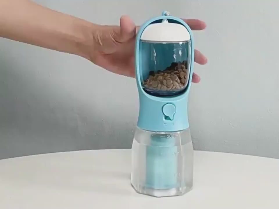 Portable multi-functional pet water cup in mint green color, featuring food and waste bag compartments for convenient pet care on the go in Dubai.