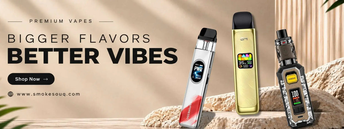 Three distinct vape pens displayed against a textured beige backdrop, featuring sleek metallic finishes in silver, gold and black with digital screens showing flavor indicators.